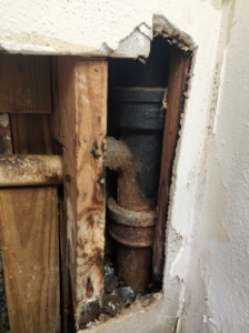 Rusted Pipe in Wall, picture from Coggin Plumbing
